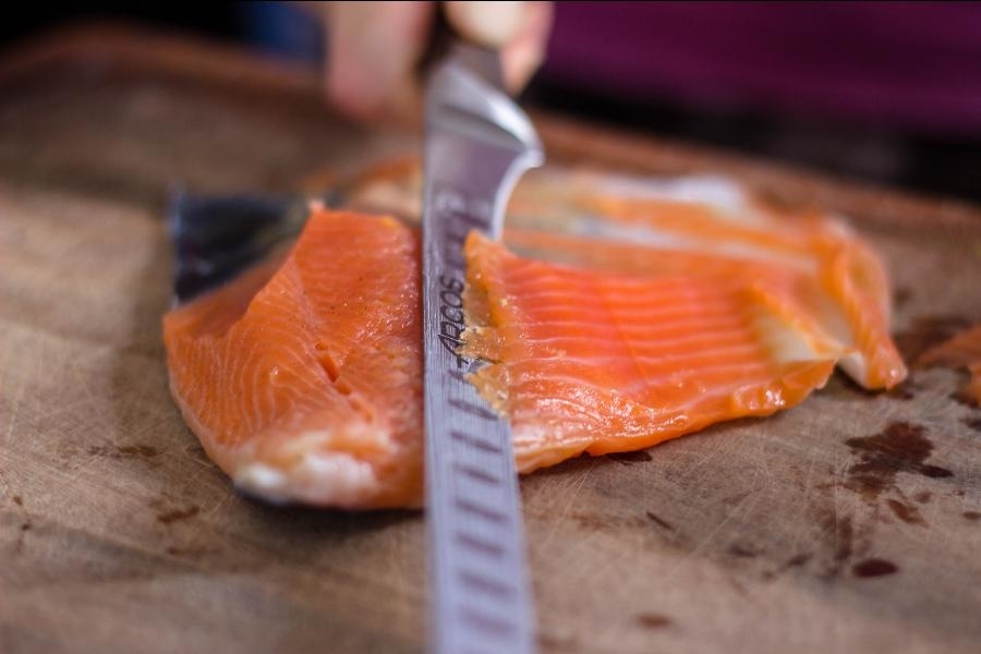 CLose Up Slicing Gravlax Salmon Cured Meat large Eat Cured Meat