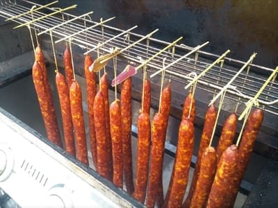 Cold Smoking Traditional Hungarian Salami , absorbing the rich flavors of the smoking wood chips.