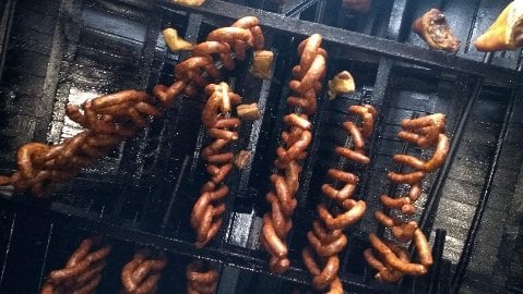 Cold Smoking Smokehouse in Slovakia, looking up to salami hanging from the ceiling.