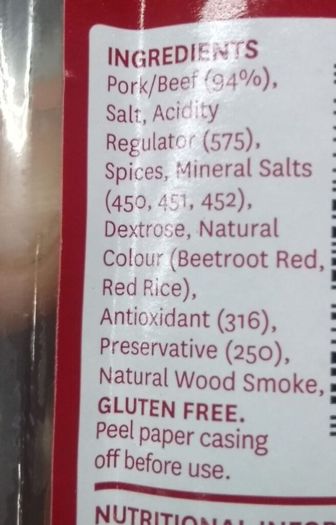 Ingredients on the packaging of commercial supermarket salami showcasing many of the additives used.