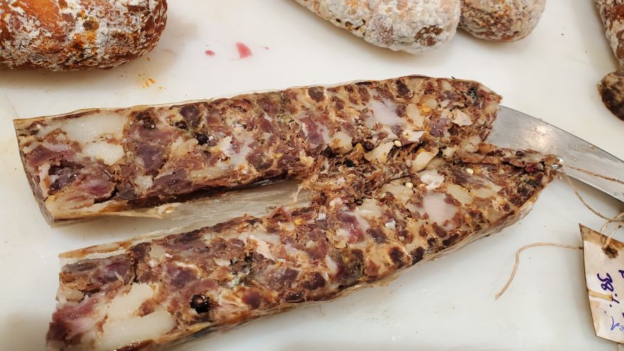 No bind salami failure, being shown by how it is cut lengthwise. Also too much fat in salami.